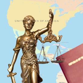 Statue of scales of justice against map of America